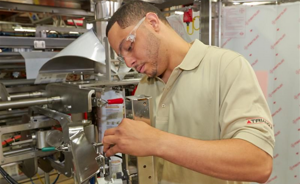 Man working on a Triangle machine.