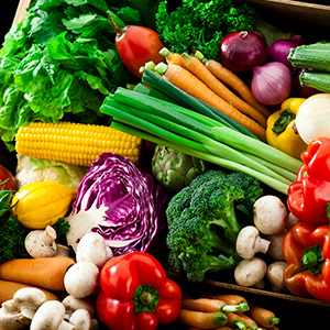 A variety of fruits and vegetables in a box.